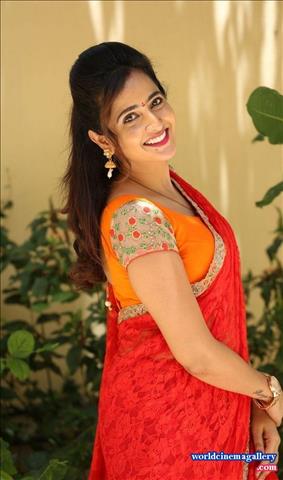 Anchor Lasya Latest Stills in Orange Saree