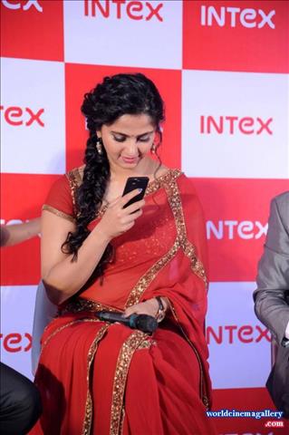  Anushka in Red Saree Stills at INTEX Aqua Smartphone Launch