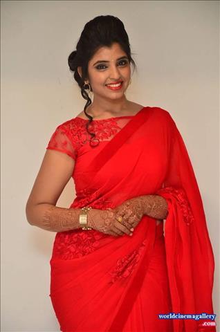 Anchor Syamala in Red Saree Stills at Okkadochadu Movie Audio Launch