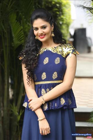 Sreemukhi latest stills in Blue Dress