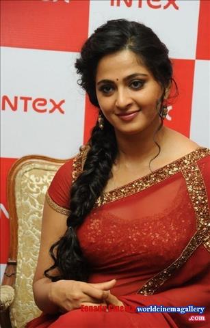 Anushka Stills in Red Transparent Saree at Intex Mobile Launch